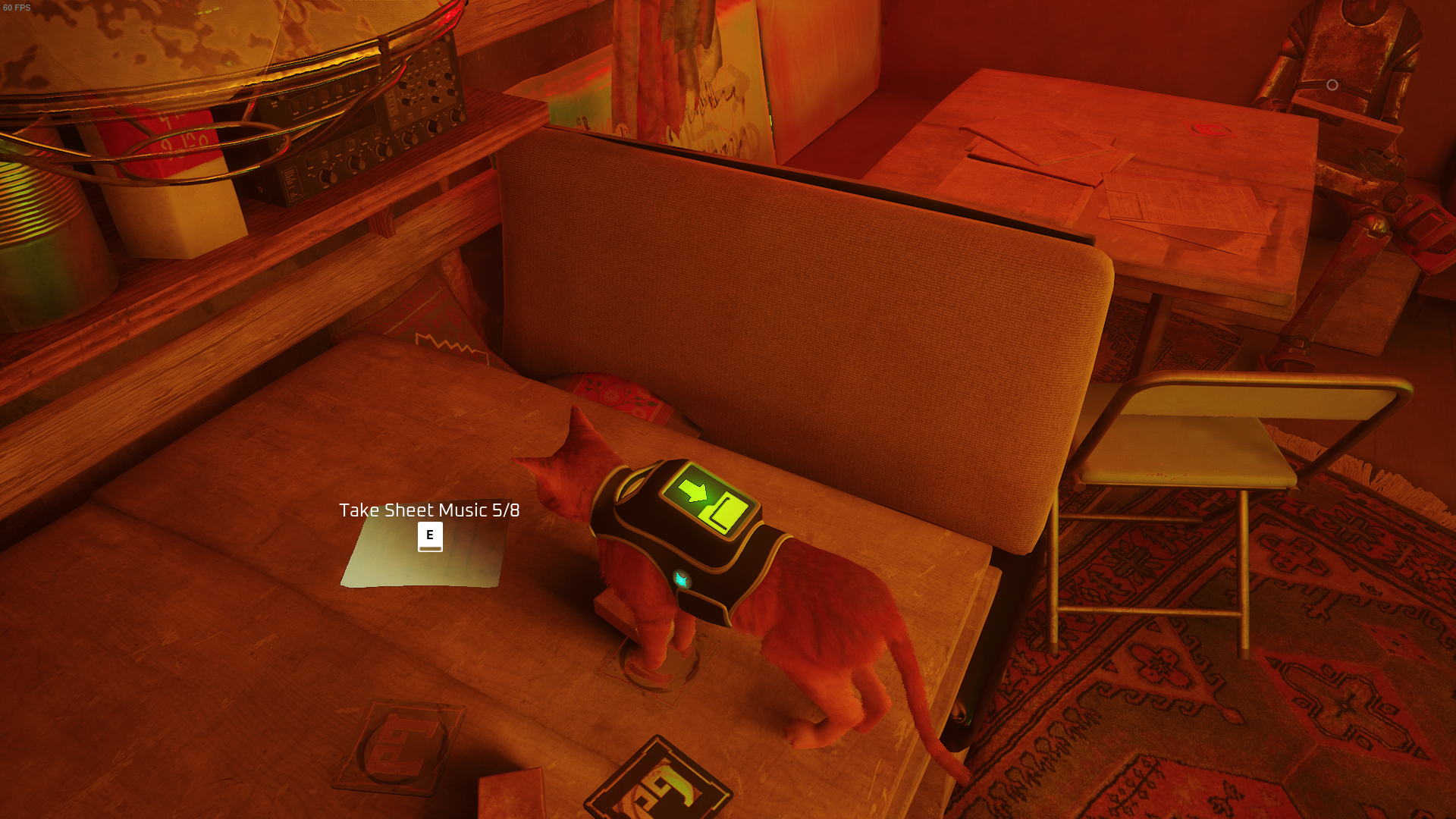 The Outsider looks at a piece of sheet music on an upstairs table in the Dufer Bar of Stray.