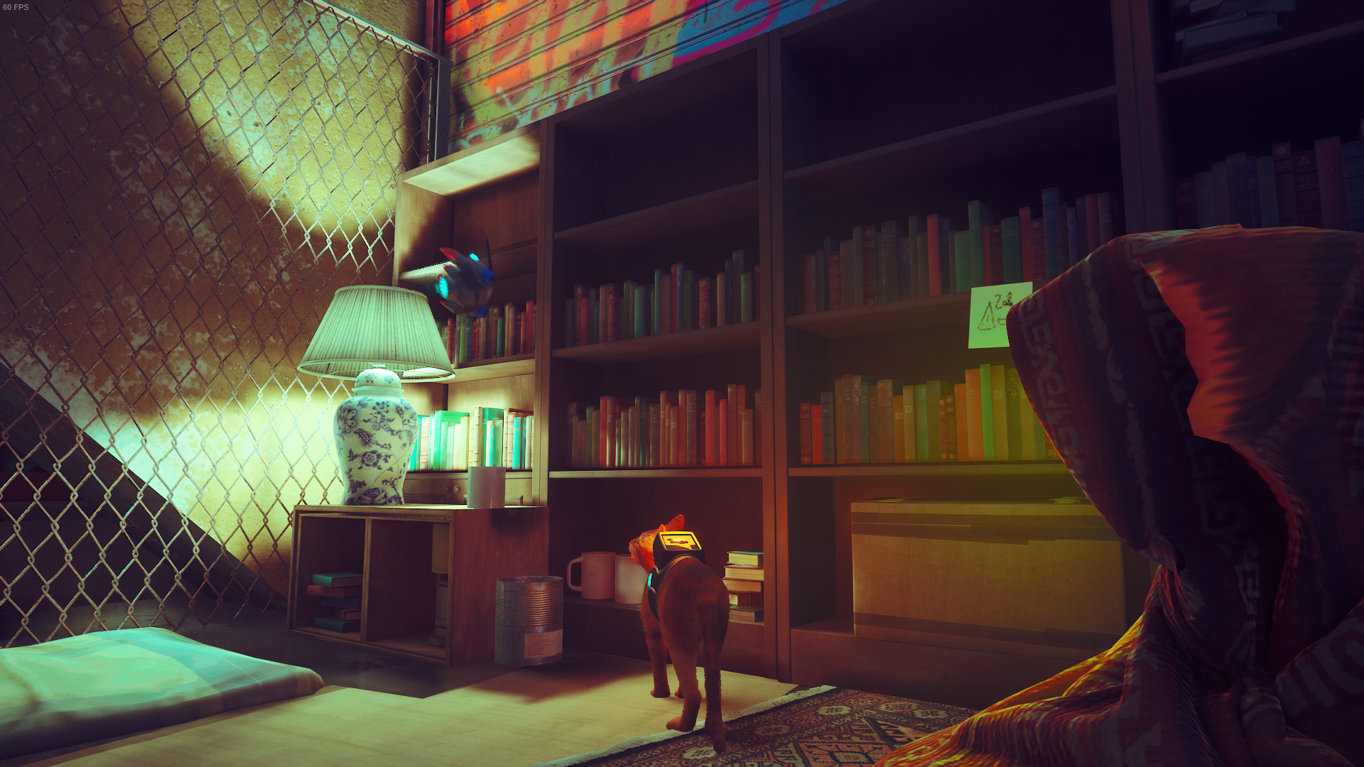 The cat looks at a tidy bookshelf in Midtown, Stray.