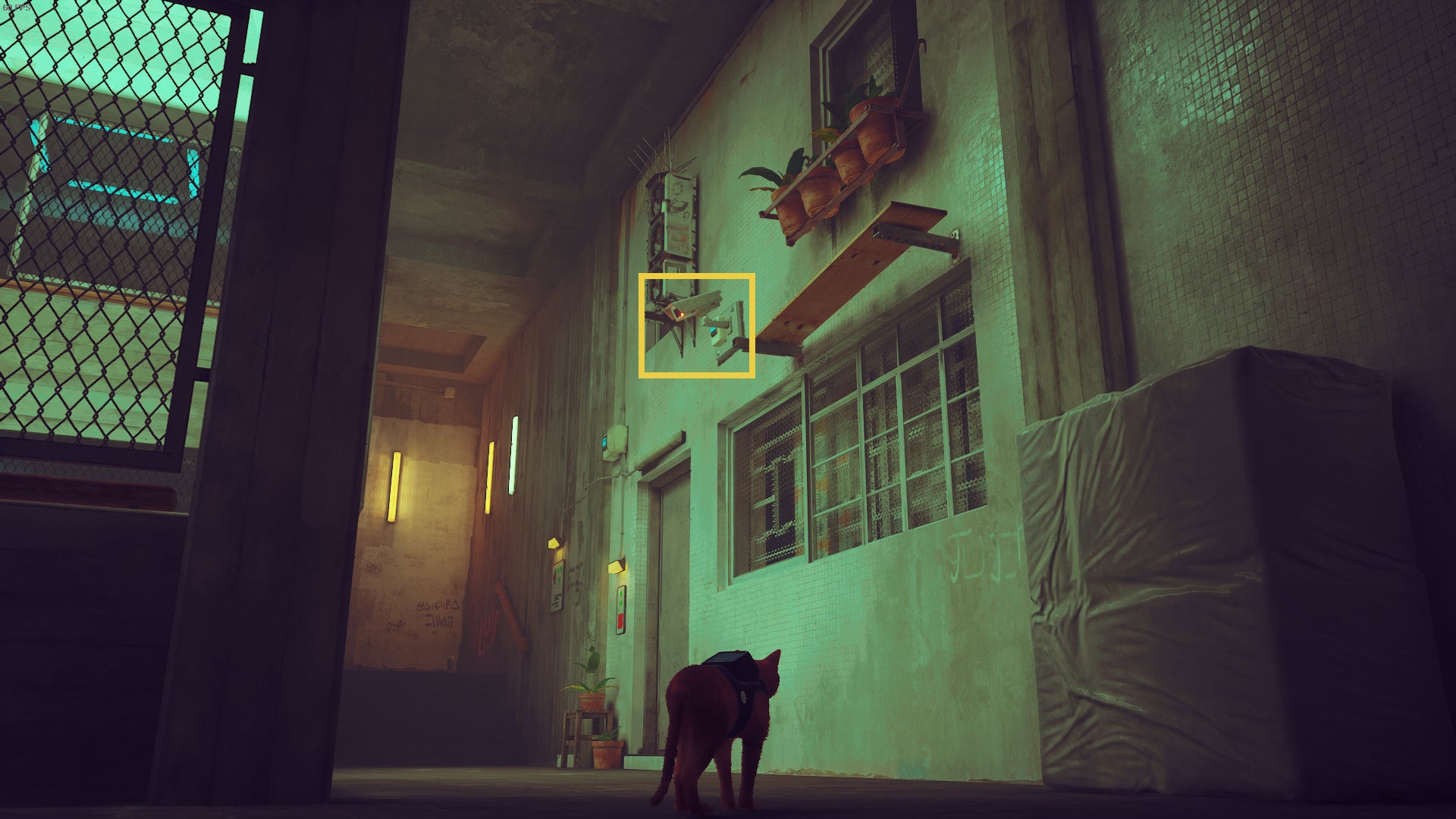 The cat of Stray looks up at a security camera in Midtown's residential district. - 8