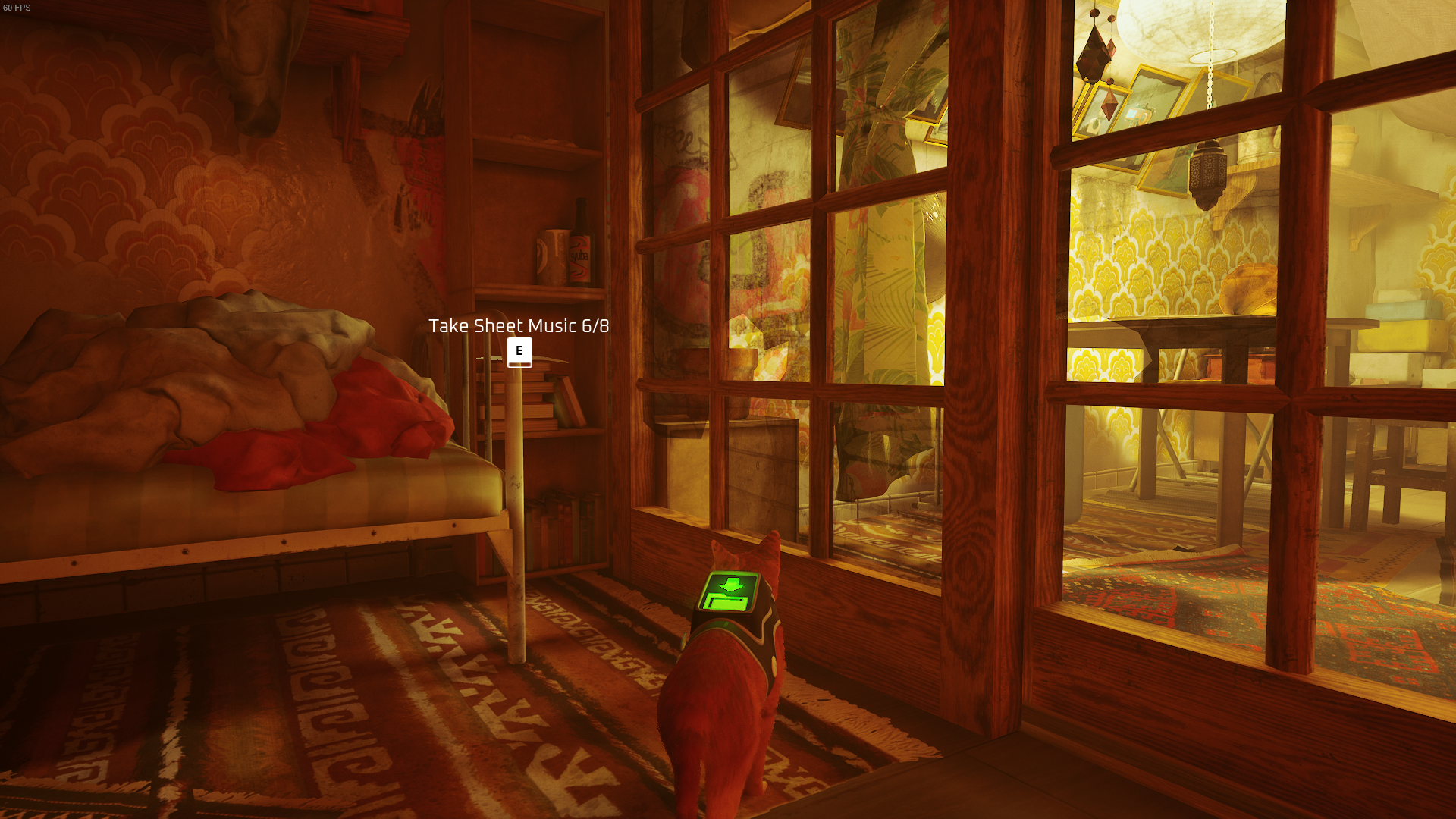 The Outsider of Stray looks at a piece of Sheet Music inside of Clementine&rsquo;s flat.