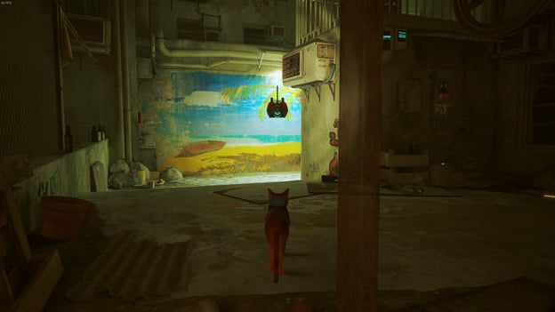 The cat of Stray looks at a beach painting outside of The Flat. - 3