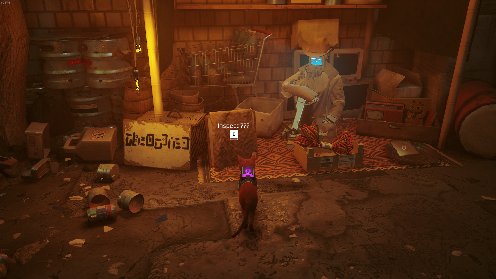 The cat looks at a relic, a memory, being sold by Azuz in Stray.