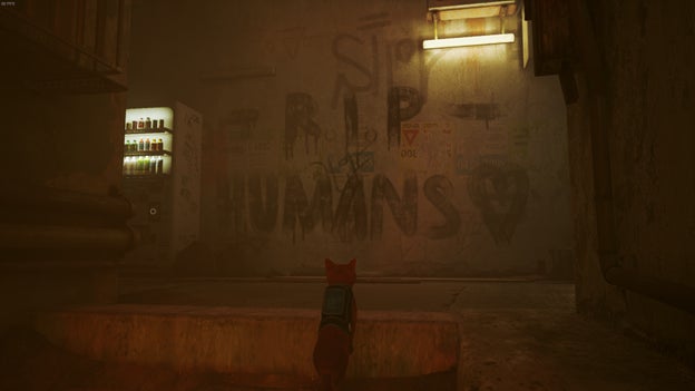 The cat looks at graffiti reading 'R.I.P. HUMANS' in Stray. - 7