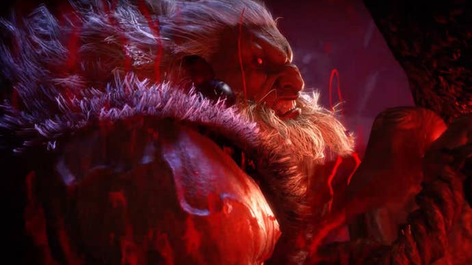 A frame from Street Fighter 6’s Akuma teaser trailer showing the character with a shock of white hair in a gloomy red chamber.