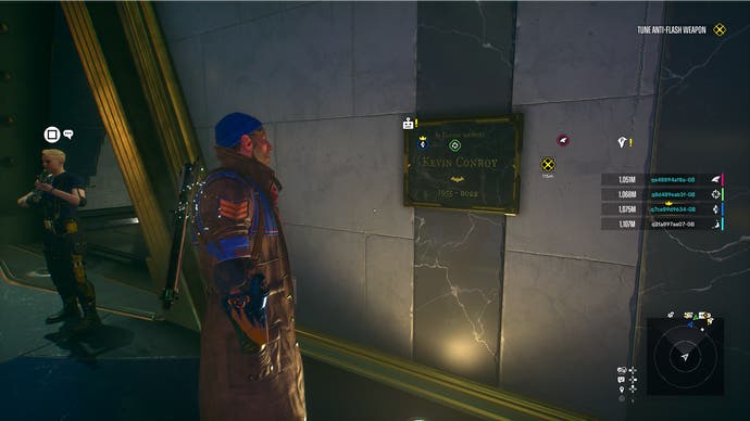 Suicide Squad screenshot showing Boomerang and the Kevin Conroy plaque