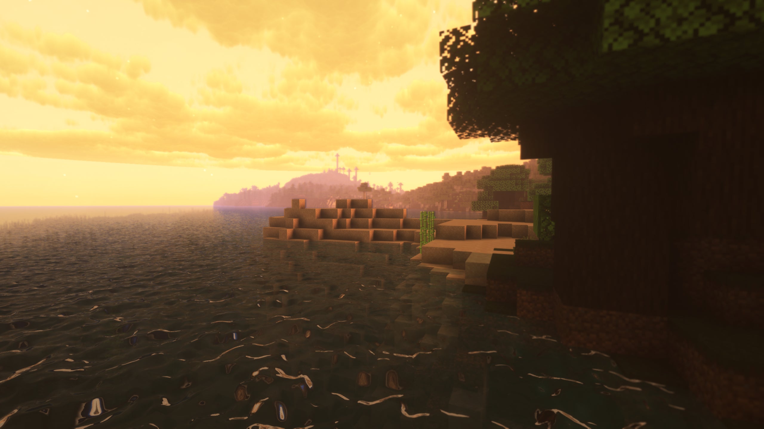 An orange sky over a coastal scene in Minecraft with Sunflawer Shaders installed.