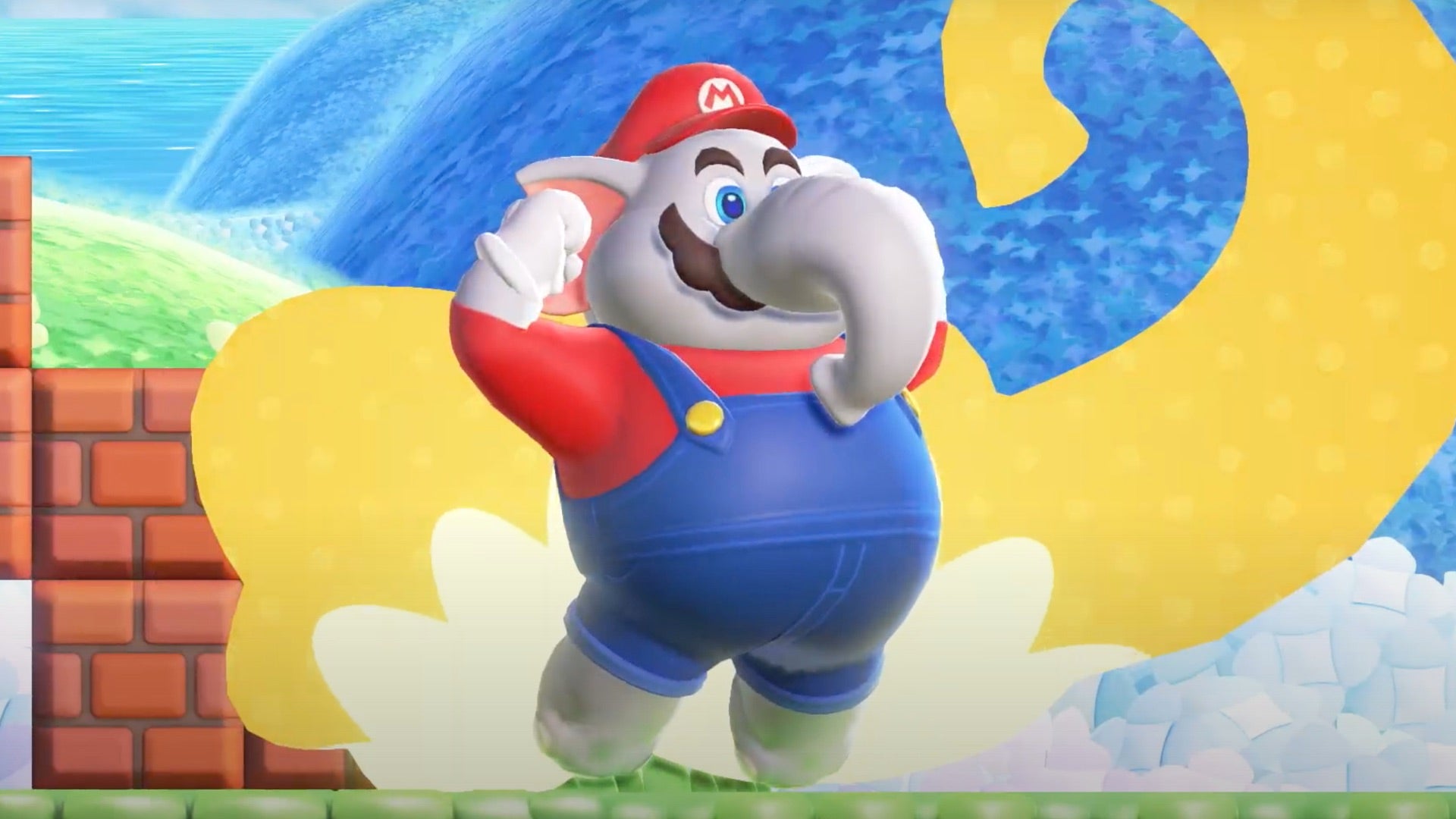 A screenshot from Super Mario Bros. Wonder showing Mario&rsquo;s transformation into a dungaree-wearing elephant.