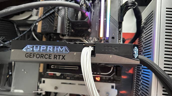 msi rtx 5090 suprim liquid soc on a test bed, card closeup
