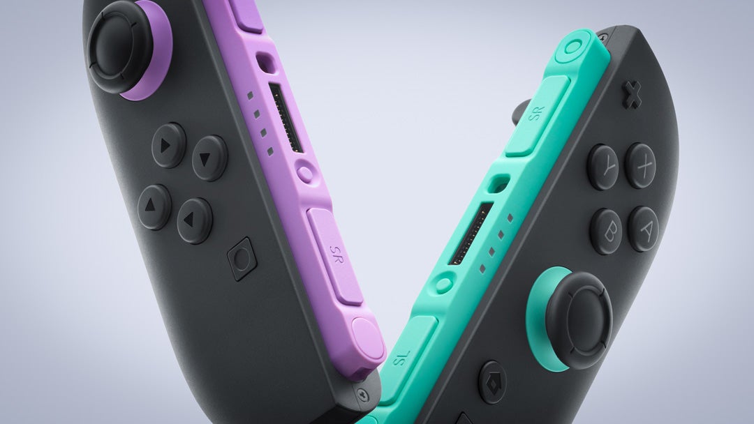 A product shot of two Joy-Con 2 controllers for Switch 2, as seen very close-up. One has what