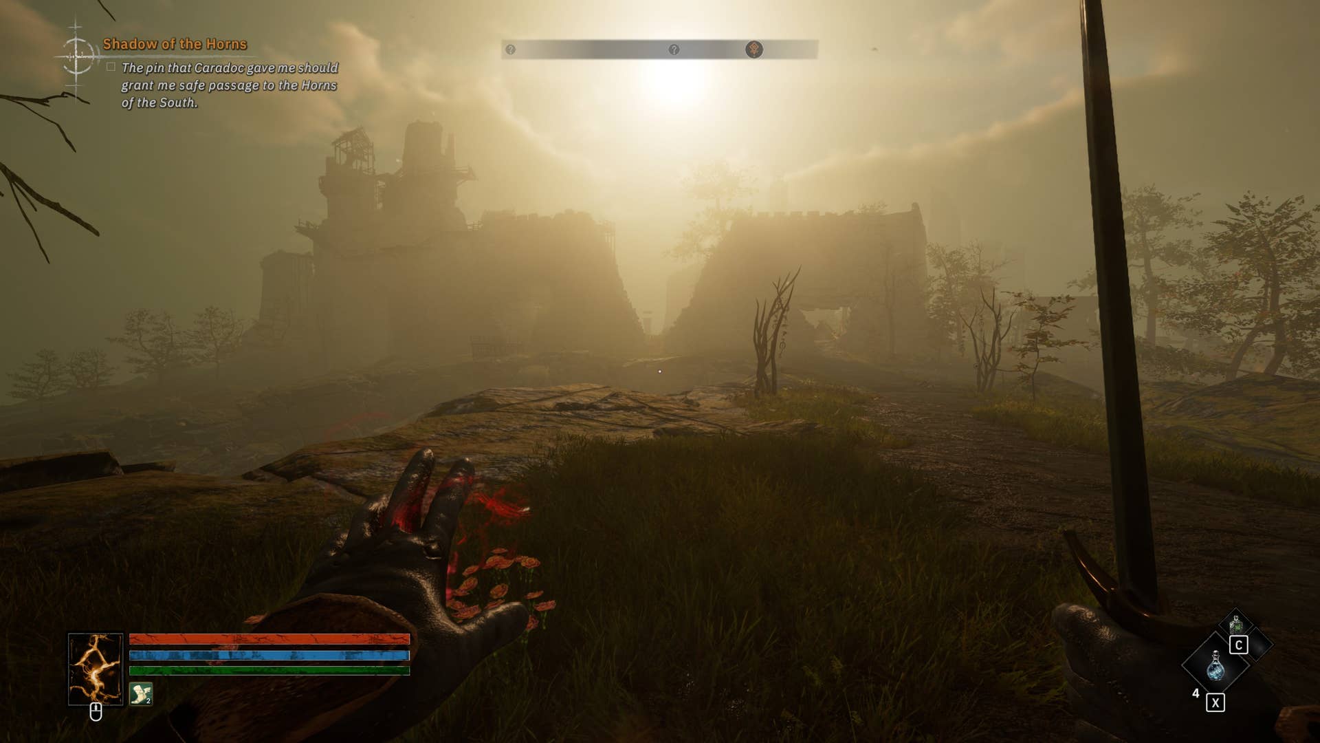 A first-person perspective of a ruined castle in the distance with a sun setting behind it, silhouetting the scene in a very exaggerated and artistic way.