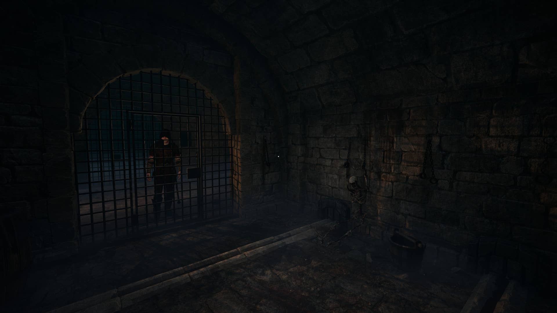 The dark interior of a medieval prison cell, complete with fleshless skeleton, iron grating, and presumably, disease.