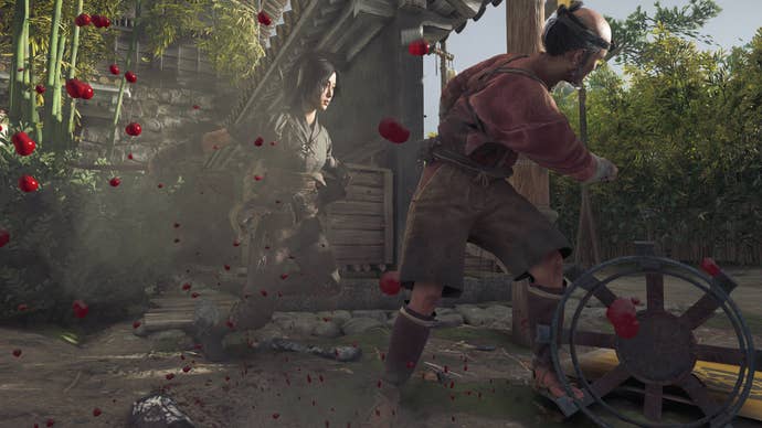 Naoe uses her tanto to stab an enemy in the back in Assassin’s Creed Shadows.