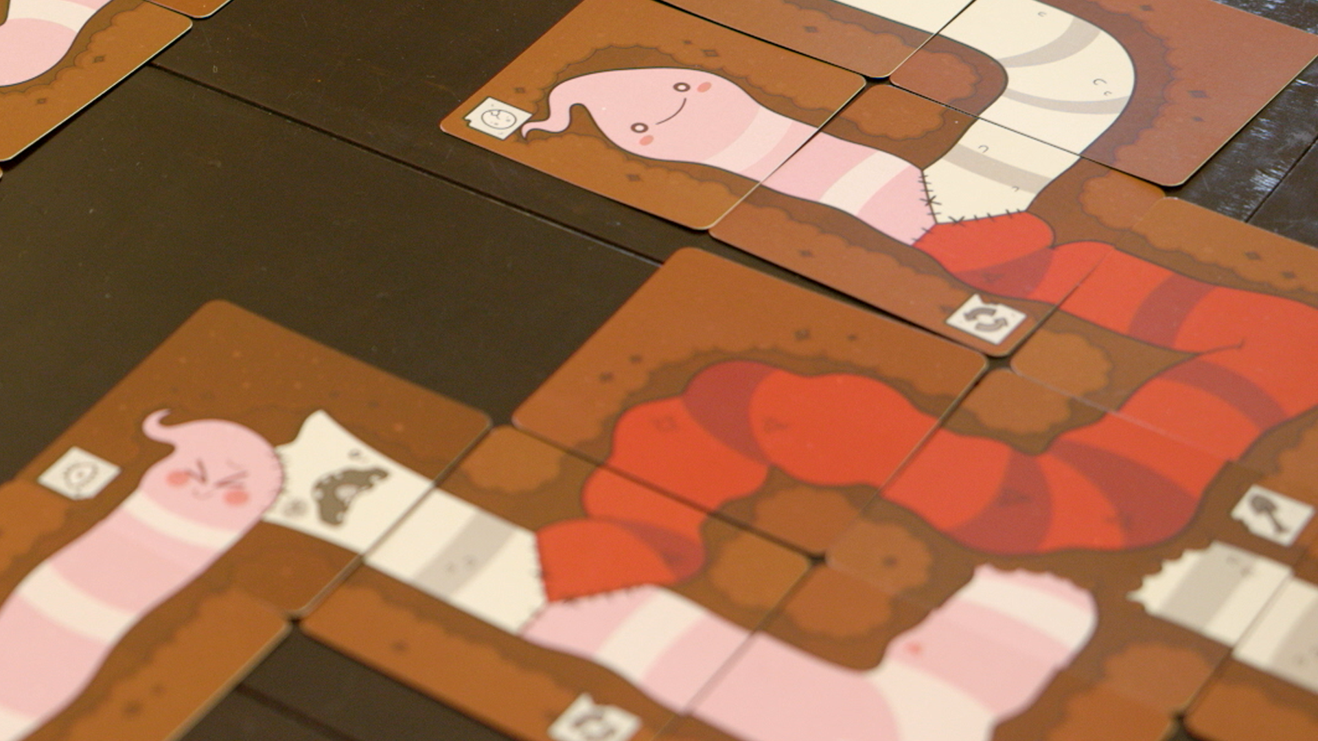 Tapeworm is a delightfully gross card game mashup of Uno and Snake