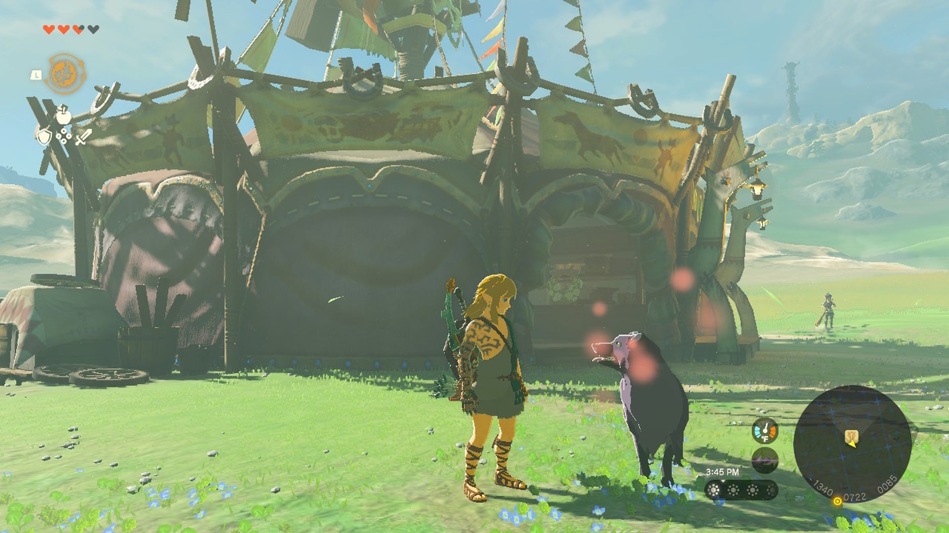 How to tame a dog Tears of the Kingdom: An anime man with blonde hair, wearing a green toga and a brown skirt, is standing next to a fluffy black dog