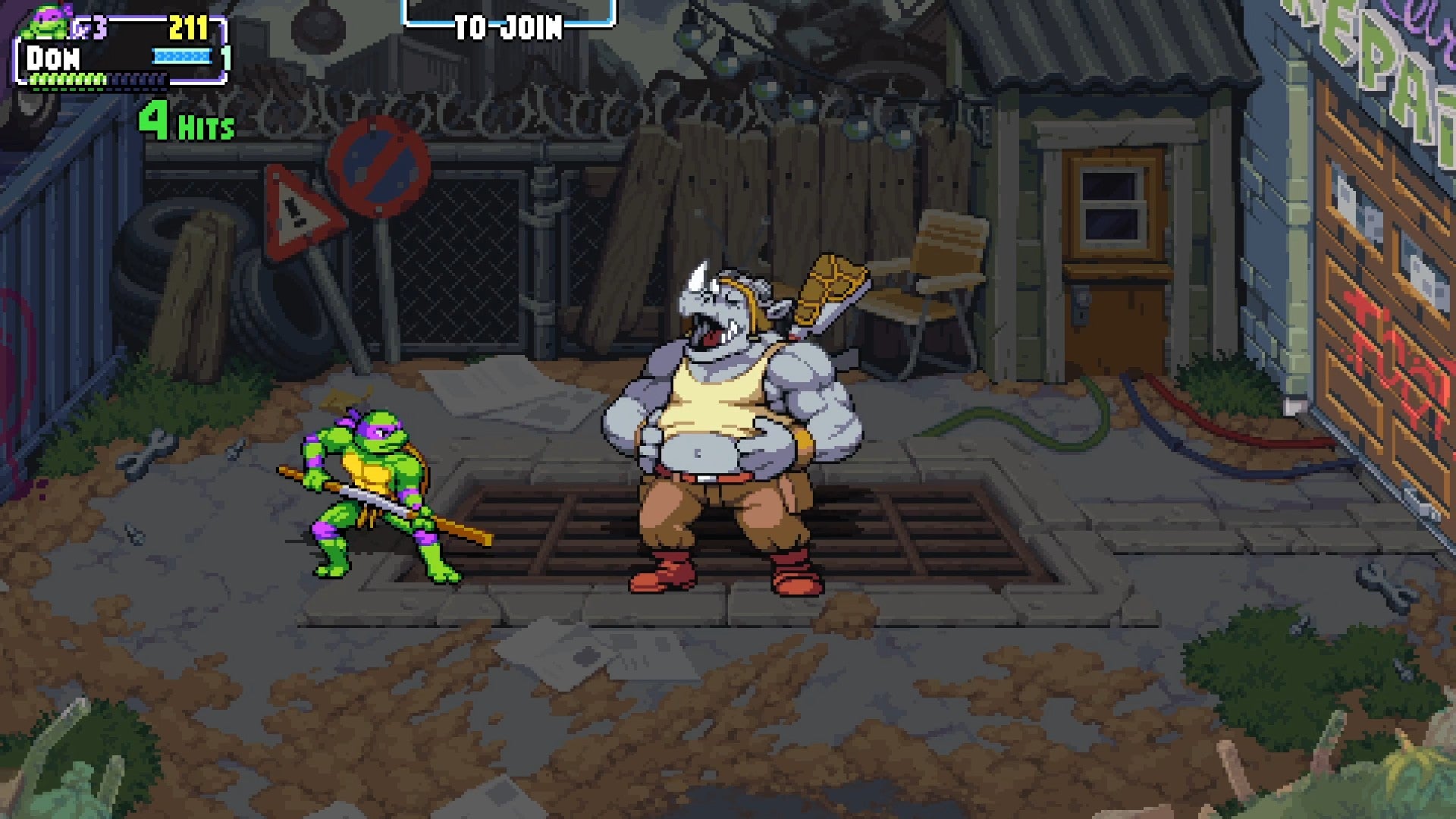 Donatello faces a laughing Rocksteady in Teenage Mutant Ninja Turtles: Shredder&rsquo;s Revenge