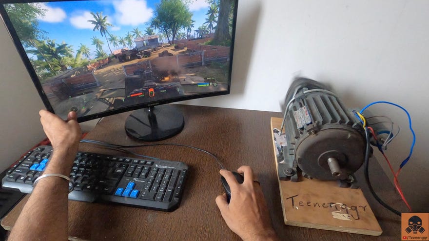 A photo showing a monitor and keyboard on a desk alongside a motor that is about to rumble like crazy.
