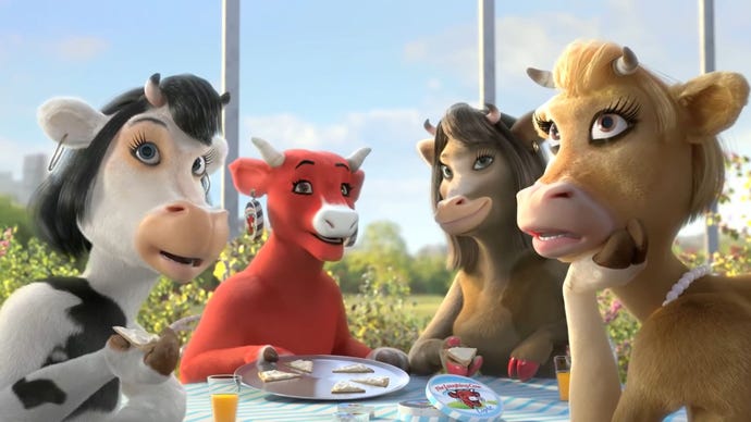 Sapi Tertawa merah dan ketiga teman sapinya sedang makan siang.