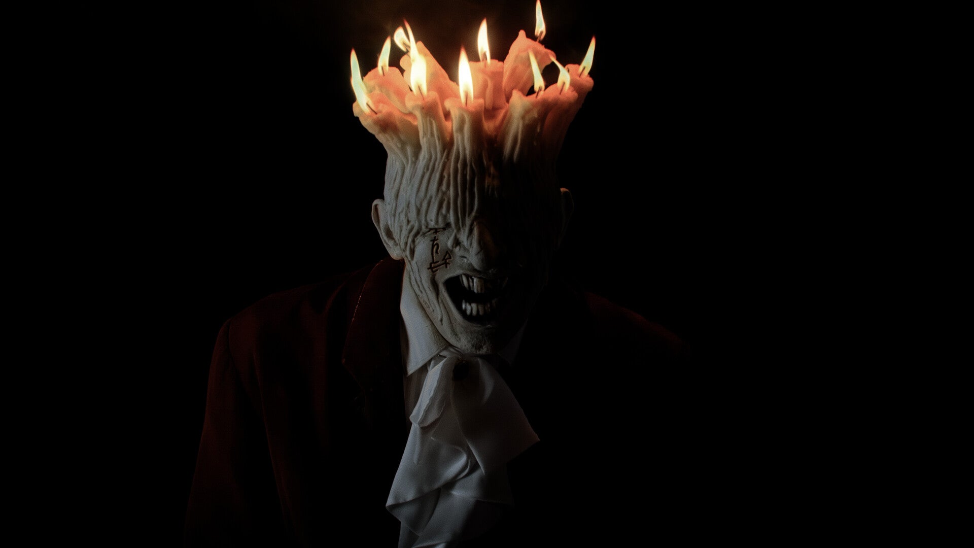 A horrible monster man with a bunch of waxy candles for a scalp, from Tenebris Somnia.