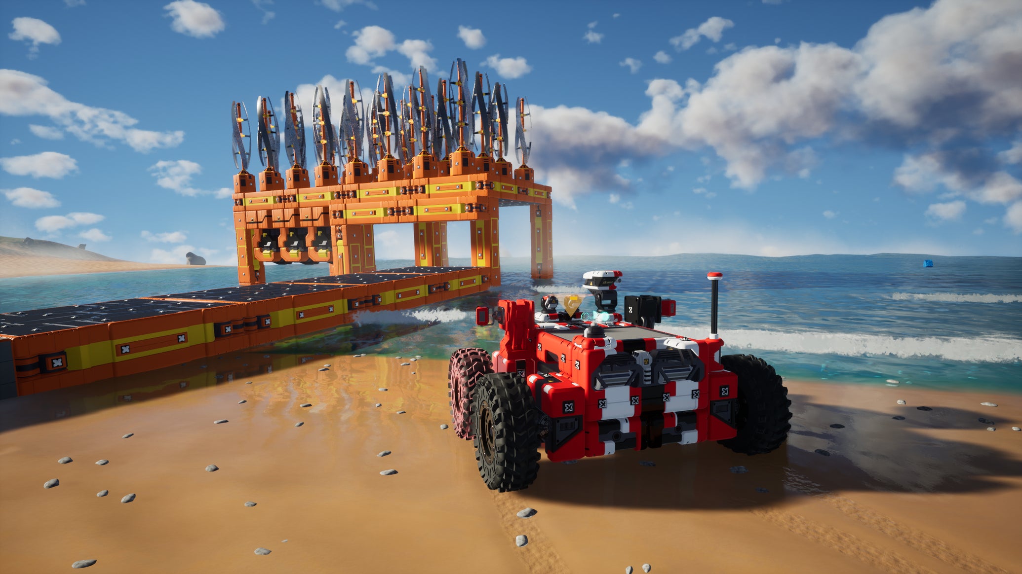 A blocky vehicle approaches a wind turbine on a beach in TerraTech Worlds - 1