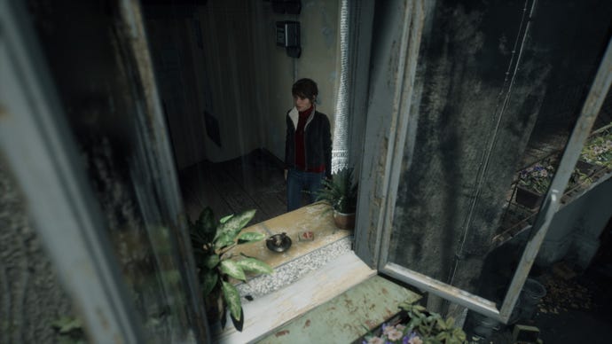 A screenshot of Marianne looking out a window in The Medium with Ultra ray tracing