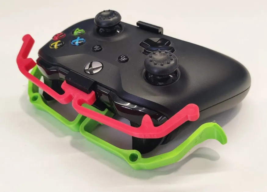 An Xbox controller with 3D-printed extensions to make the bumpers more accessible.