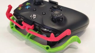 An Xbox controller with 3D-printed extensions to make the bumpers more accessible.