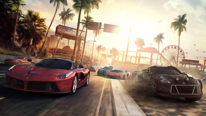Promotional image for The Crew showing a number of cars racing toward the camera against the backdrop of a Los Angeles sunset. The ferris wheel from the Santa Monica Pier is in the background