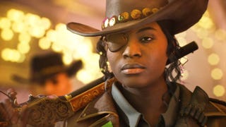 A woman with a cowboy hat and eye patch looking directly ahead with someone else wearing a cowboy hat over her right shoulder.