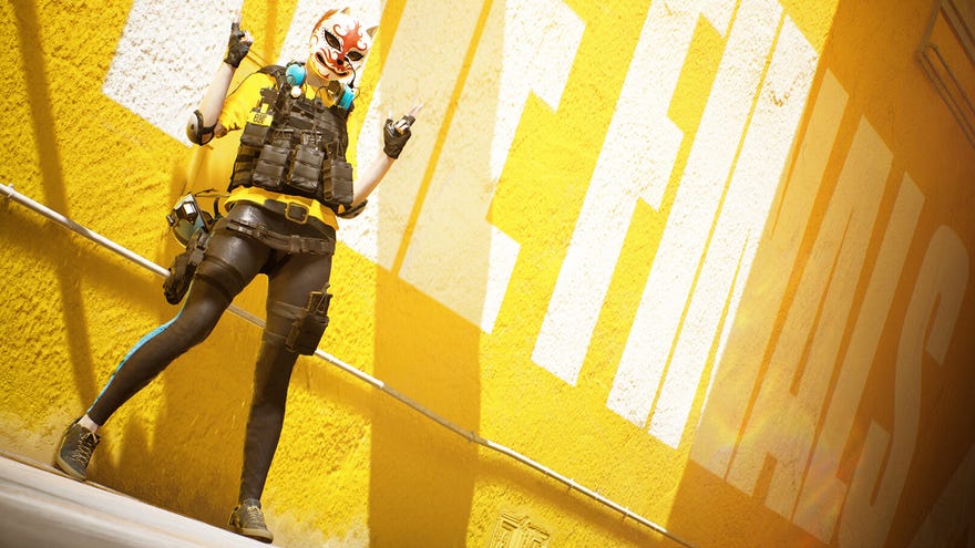 A character wearing a mask and tactical jacket poses with both arms up on a yellow wall in The Finals