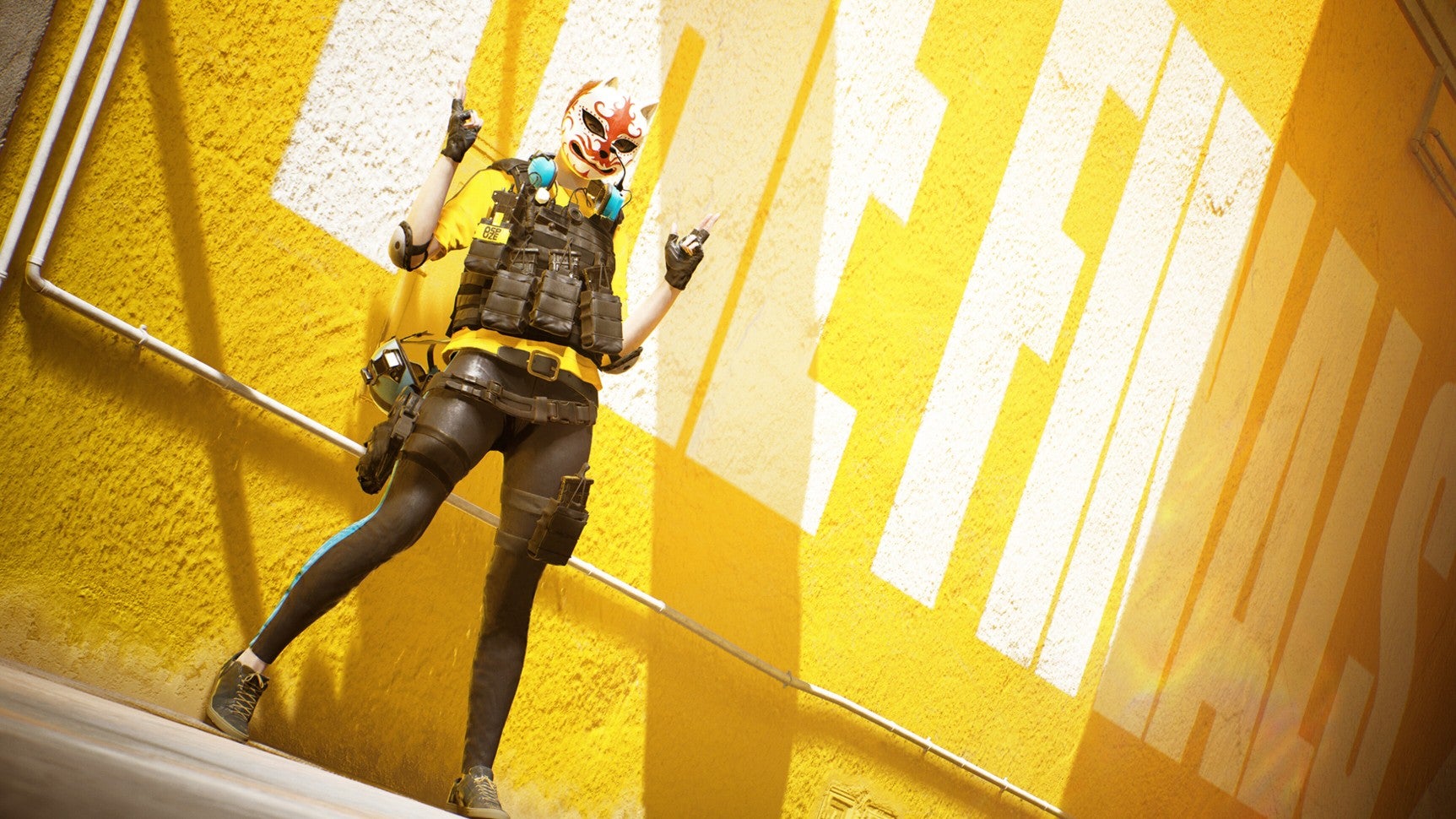 Promo image for The Finals showing a player character in a cat-like mask doing the double &lsquo;finger guns&rsquo; pose against a yellow background