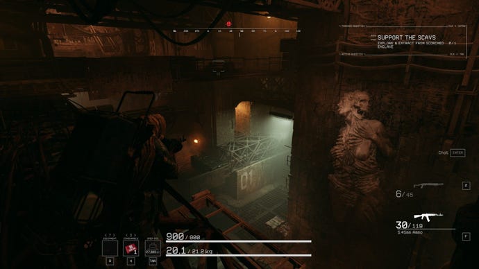 The player looks down into a factory where a twisted machine corpse erupts from the wall.