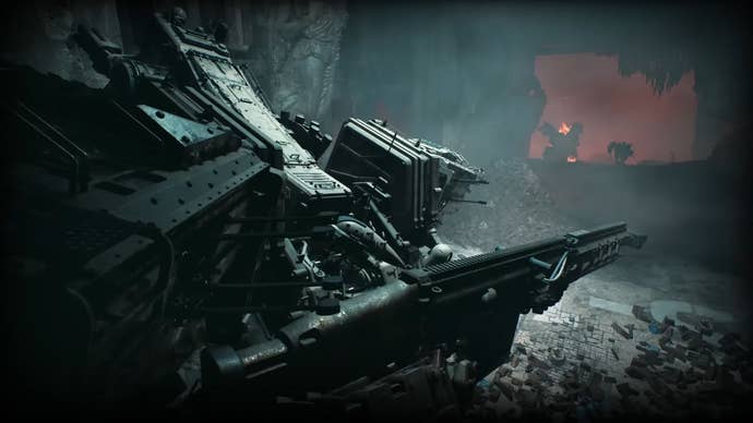 A giant mech faces the camera in a grey warzone.