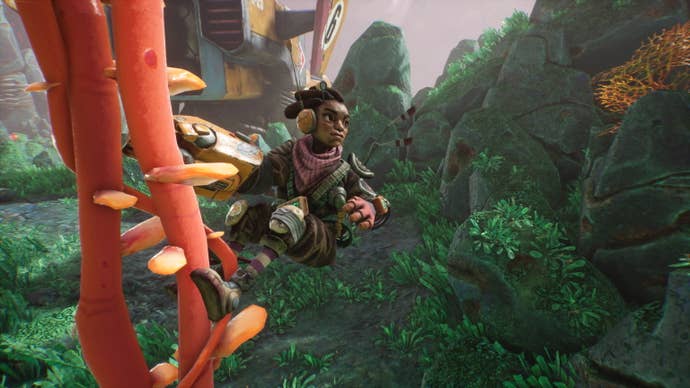 A young woman gazes out into the distance while hanging from a vine in The Gunk