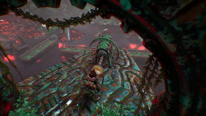 A young woman pulls a metal ball out from an ancient machine in The Gunk