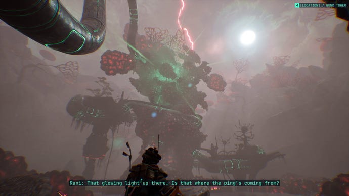 A young woman looks up at an ominous tower covered in gunk in The Gunk