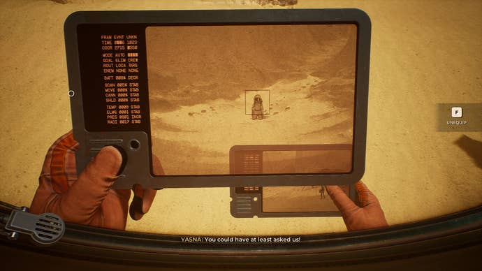 Looking at a photo in The Invincible.