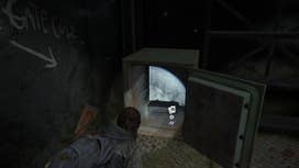 Ellie collecting loot from an open safe after inputting the combination in The Last of Us Part 2 Remastered on PS5
