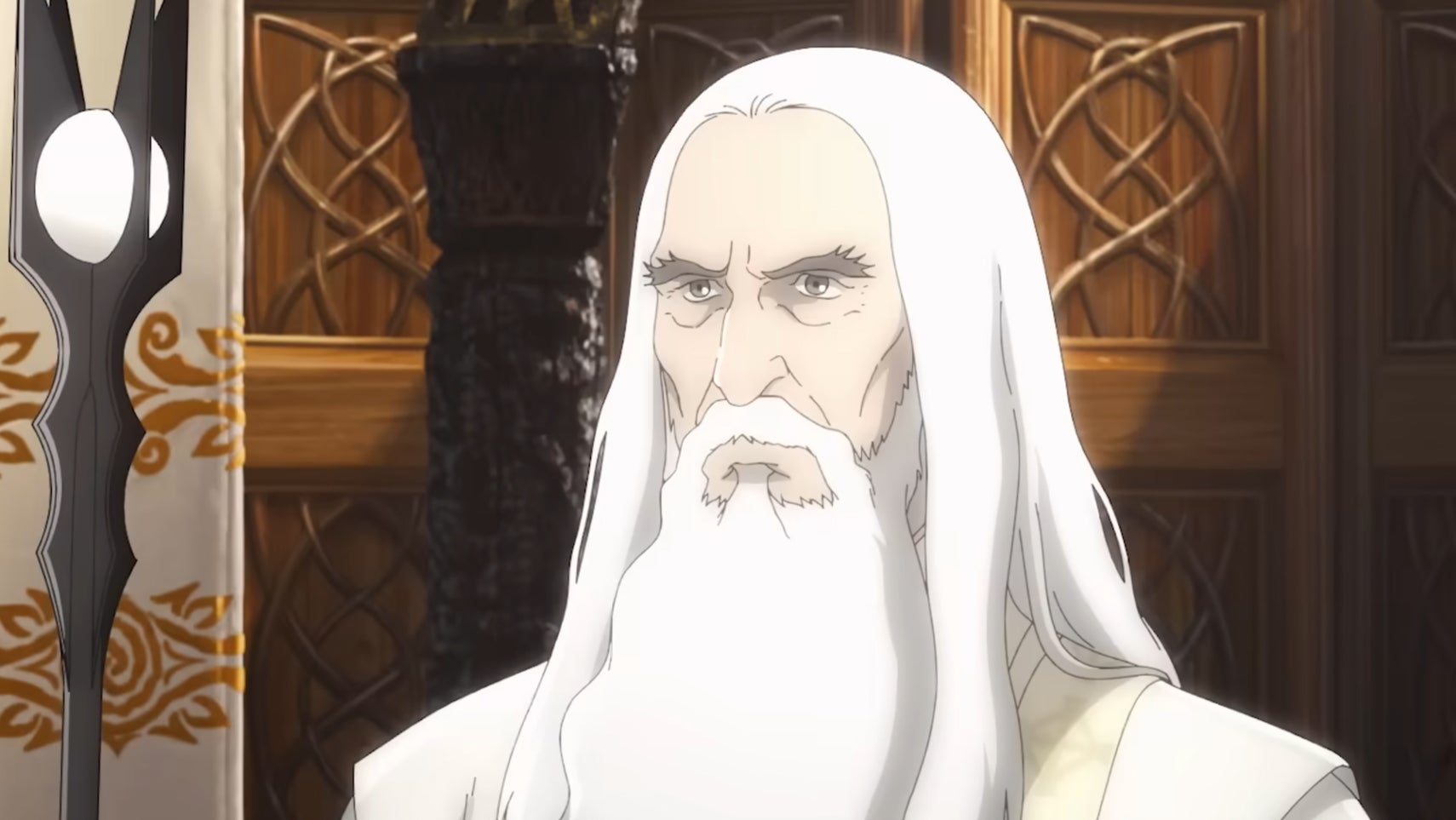 An anime version of Saruman, a serious looking man with long white hair and a similar beard in The Lord of the Rings: The War of the Rohirrim. - 1