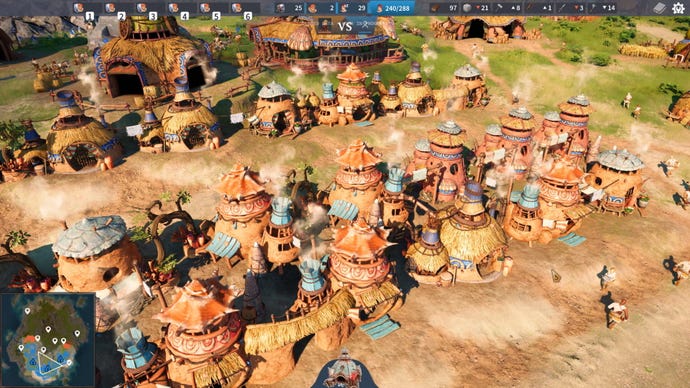 A row of straw and mud-brick houses with smoking chimneys in The Settlers