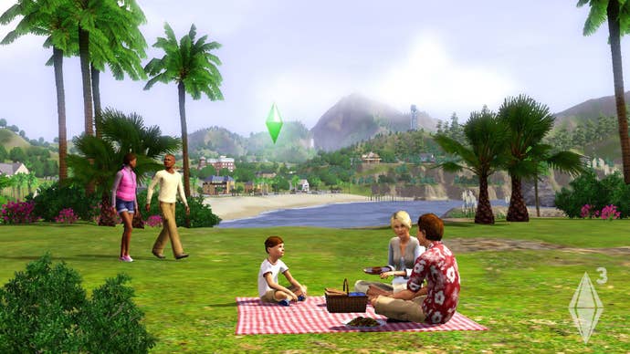 A Sim family picnic on a blanket in a beachside park, with sprawling views of the ocean and town visible in the distance, as another couple walks by.