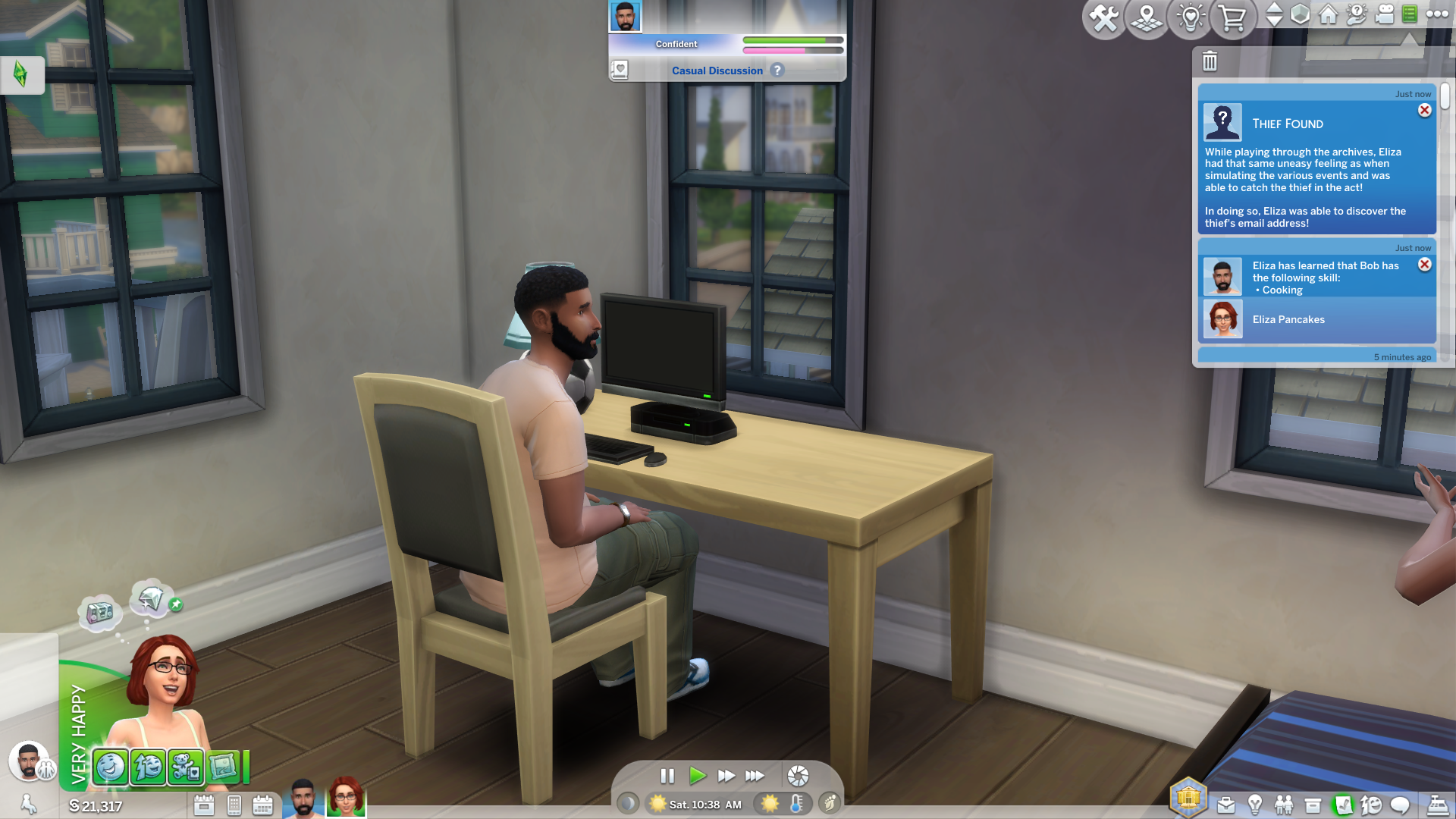 Bob Pancakes chats to his wife Eliza while sitting at the computer desk in his sparsely-furnished bedroom.