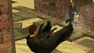 A screenshot of The Specialists mod for Half-Life, showing a trenchcoated Gordon Freeman diving backwards while firing a shotgun towards a dashing G-Man in the distance.