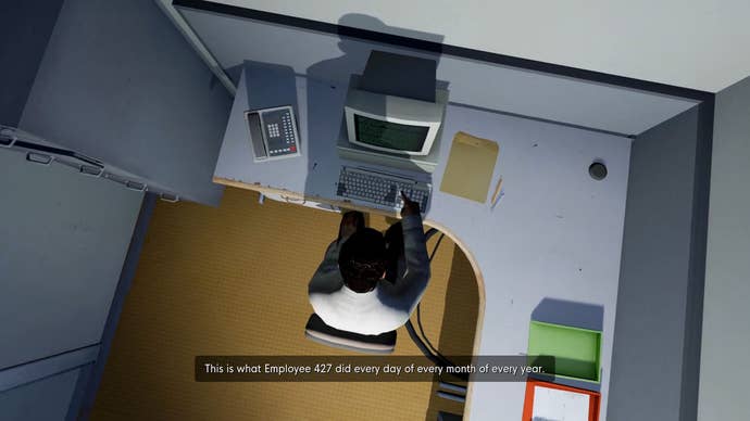 A screenshot from The Stanley Parable showing, from a top-down view, a male-looking character in a grey office, sat at a corner desk, pressing one button on the keyboard of a boxy computer in front of them. The game’s Narrator tells us that this person does this every day of every month of every year.