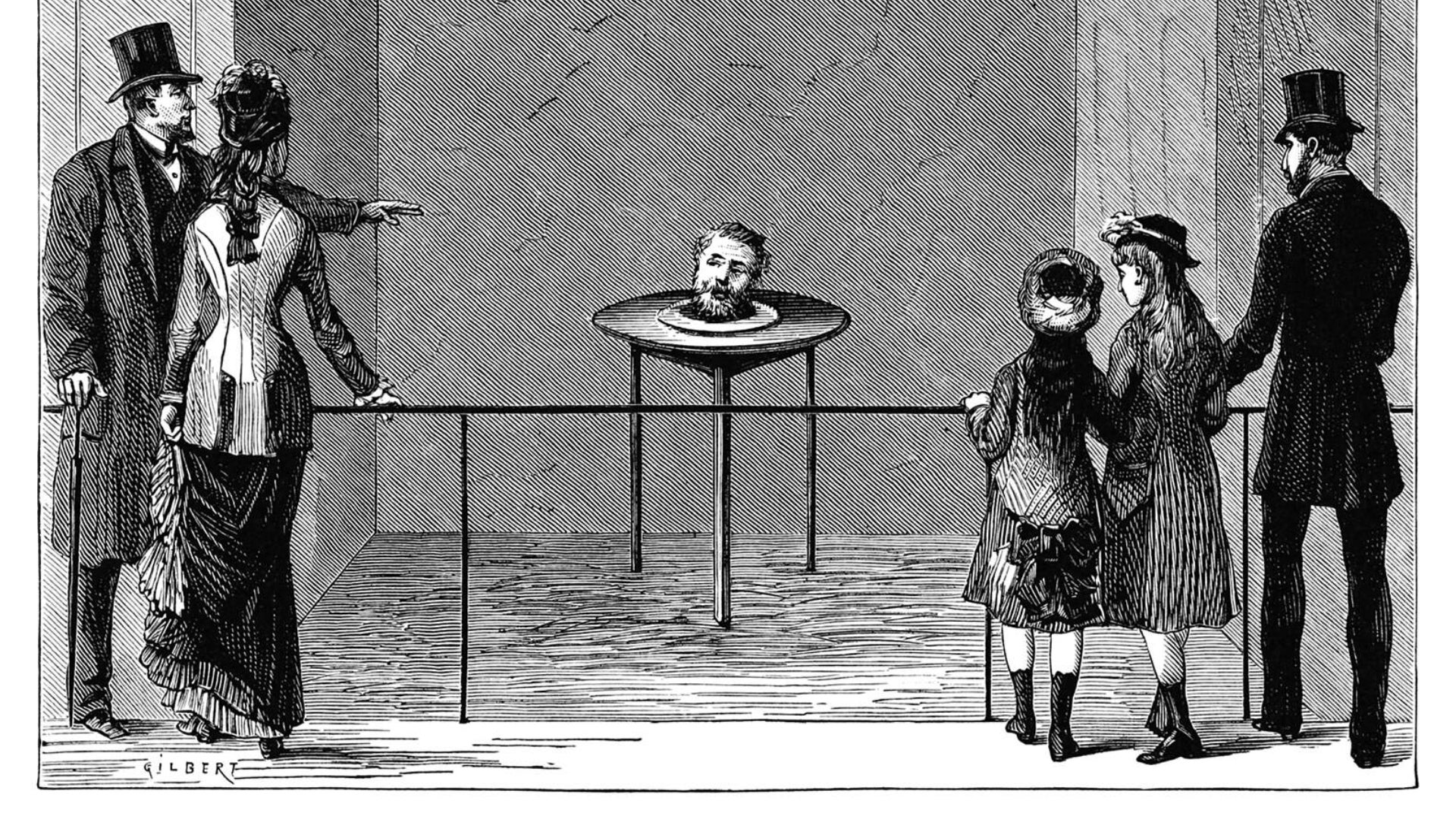 A head on a plate talks as a crowd gathers to point and listen. - 1