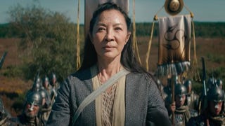 An image from Netflix's The Witcher prequel The Witcher: Blood Origin showing Michelle Yeoh's character backed by marching soldiers.