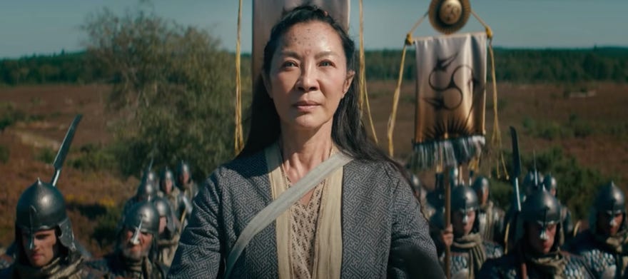 An image from Netflix’s The Witcher prequel The Witcher: Blood Origin showing Michelle Yeoh’s character backed by marching soldiers.