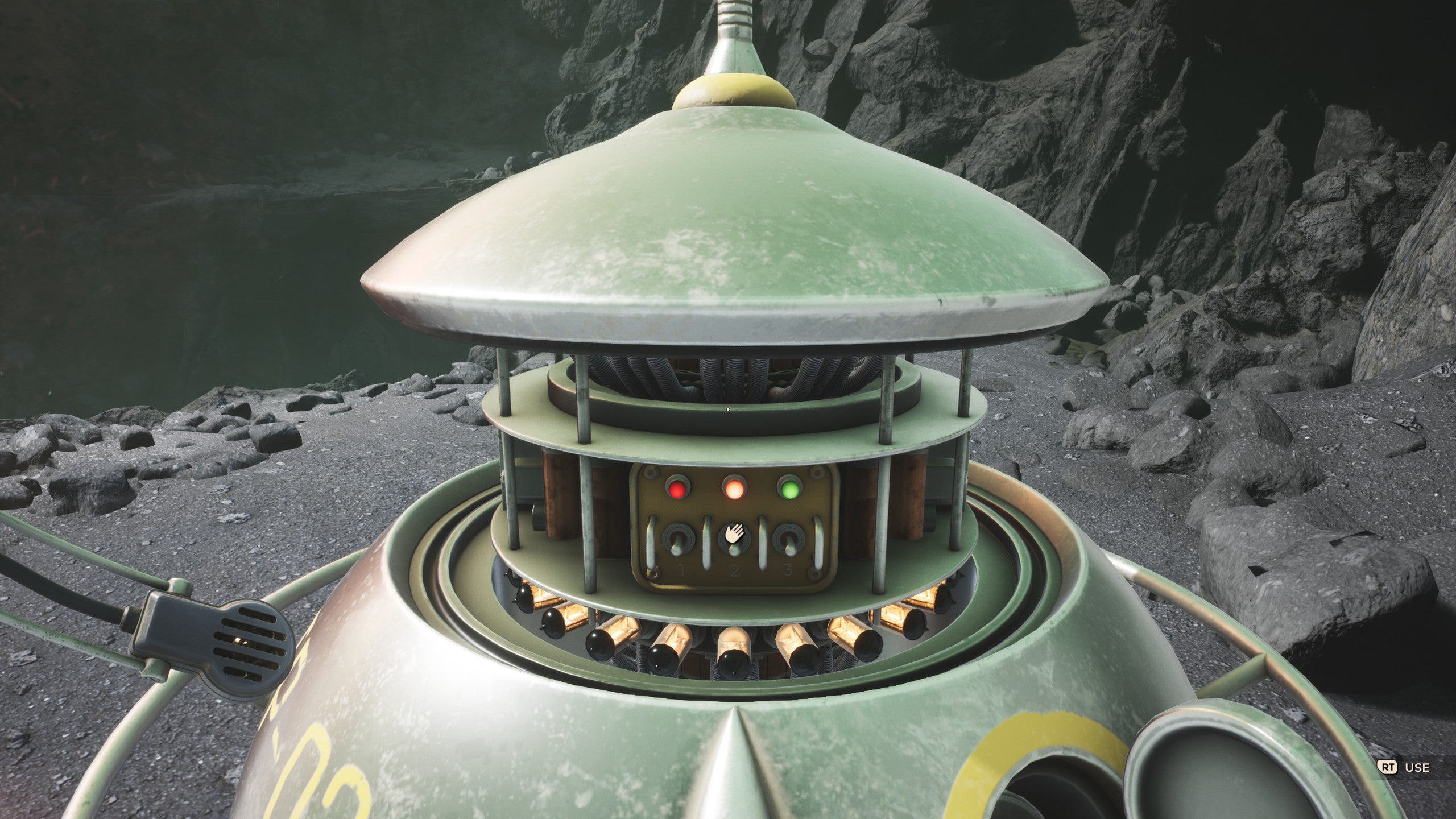 A screenshot from The Invincible. We see the top of a circular, metallic probe popped out to reveal some switches and flashing lights within.