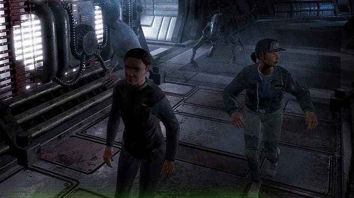 A screenshot from Alien: Blackout showing two survivors being stalked by a Xenomorph through a dimly lit space station corridor, as seen through a grainy security camera.