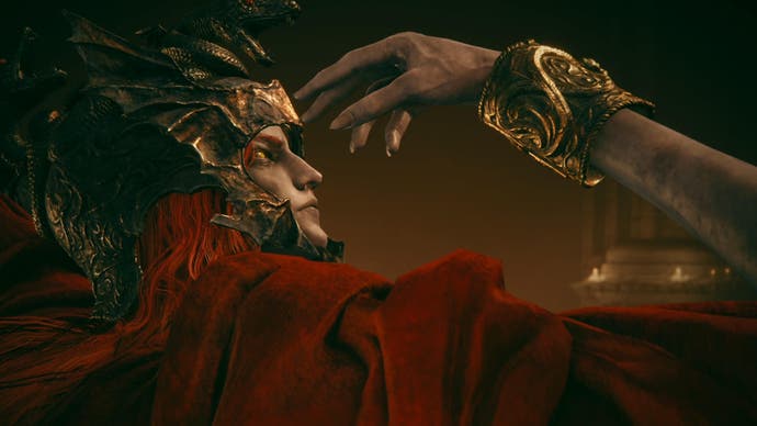 Elden Ring Shadow of the Erdtree screenshot showing Messmer boss cloaked in red reaching for his own eye