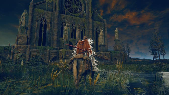 Elden Ring Shadow of the Erdtree screenshot showing player character mounted stood outside an imposing gothic cathedral